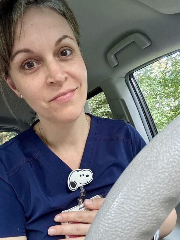 Kristen with a snoopy badge.